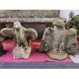 Two antique carved sandstone garden figures of eagles with spread wings, H. 50cm.