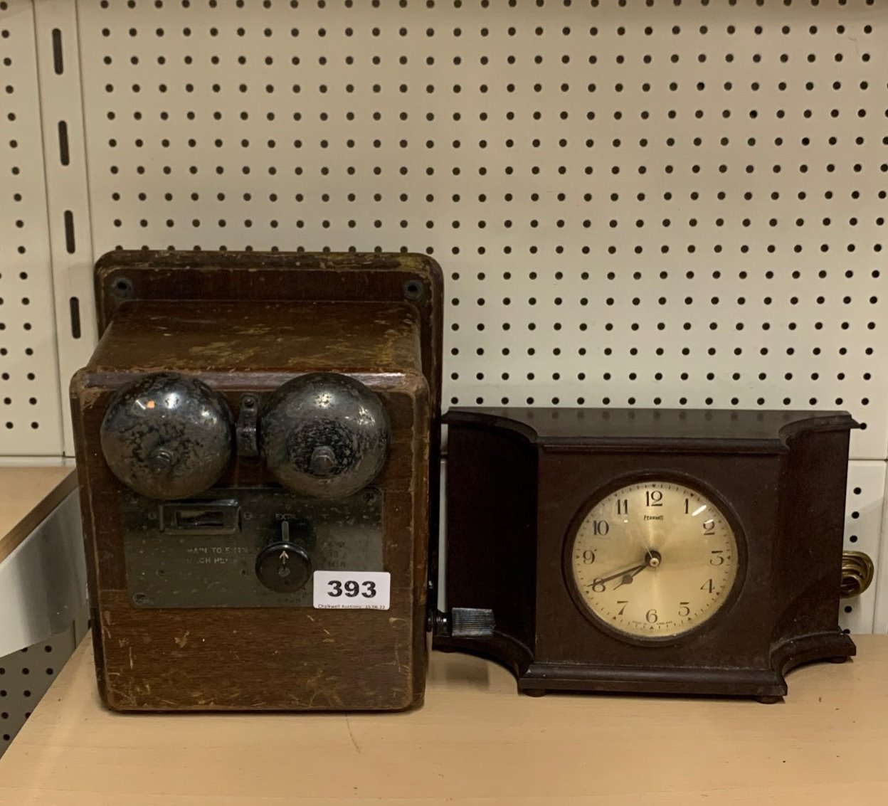 A Farrenti electric Bakelite mantle clock and telephone extension valve.