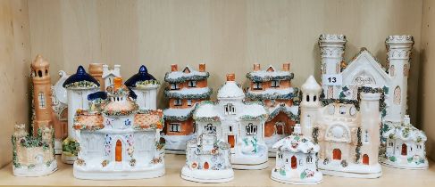 A group of early 19th century porcelain Pearlware Staffordshire castles and houses tallest H. 23cm.
