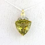 A 9ct yellow gold pendant set with a large trillion cut citrine and diamonds, 3 x 1.5cm.