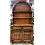 An arch topped oak dresser, W. 93cm, H. 188cm.