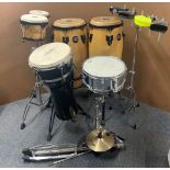 A group of percussion instruments, including Stagg and Meynell bongos and others.
