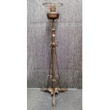 An Art Nouveau copperised brass oil lamp stand, H. 142cm.