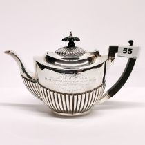 A hallmarked silver tea pot.