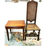 A lovely 18th century style cane seated and backed hall chair with a mahogany side table.