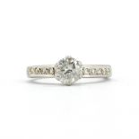 A hallmarked 18ct white gold ring set with a large brilliant cut diamond, approx. 1ct, with