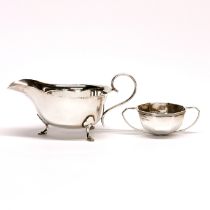 A hallmarked silver sauce boat with a octagonal two handled hallmarked silver bowl (without foot).