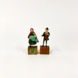 Two early 20th century painted lead figures of Irish characters mounted on wooden bases, H. 10cm.