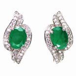 A pair of 925 silver earrings set with oval cut emeralds and white stones, L. 1.9cm.