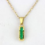 A matching 18ct yellow gold (stamped 18K) emerald set pendant on a 9ct yellow gold chain, chain L.