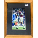 A framed autographed photograph of Paolo Di Canio.
