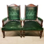 A pair of Victorian mahogany armchairs.