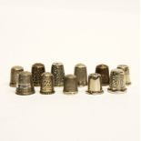 A collection of eleven hallmarked silver thimbles.