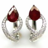 A pair of 925 silver earrings set with pear cut rubies and white stones, L. 1.7cm.