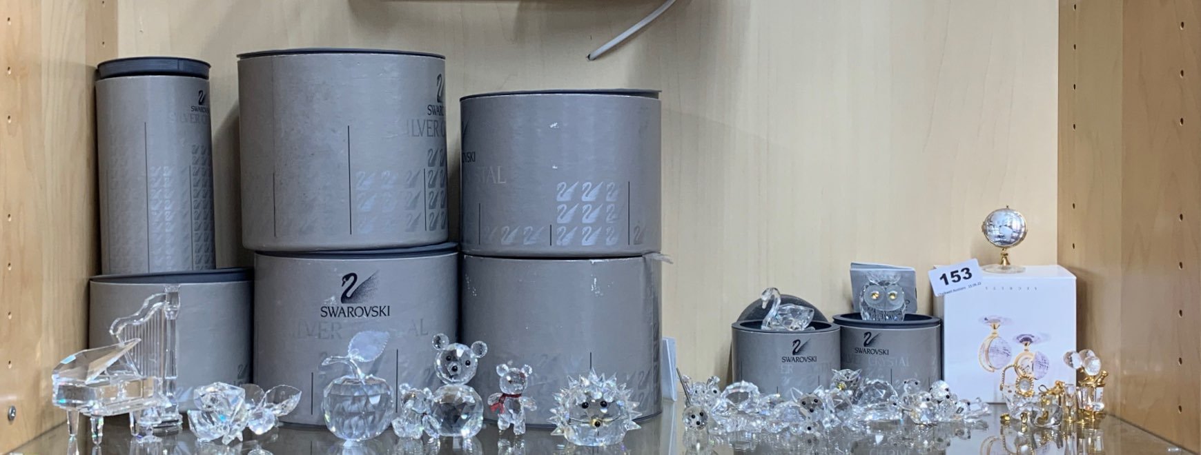 A quantity of Swarovski and other crystal items, some with boxes.