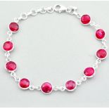 A 925 silver bracelet set with faceted rubies, L. 19cm.