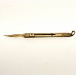 A silver propelling tooth pick, open L. 8cm.