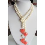 Fourty-four inch Cultured Peal & Peach Jade Necklace. A superb cultured pearl necklace with peach