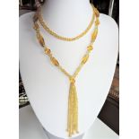 Antique Art Deco Gold Glass Bead Flapper Necklace with Tassle. A circa 1920's glass bead necklace