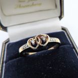 Diamond Ring New with Gift Pouch. A very pretty heart ring in gold on sterling silver set with 6