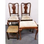 A pair of upholstered mahogany dining chairs together with a matching footstool and a further