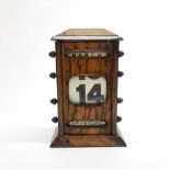 A 1930's oak desk calendar, H. 22cm.