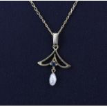 An 18ct yellow gold pendant and chain set with a sapphire and a freshwater pearl, L. 41cm, approx.