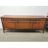 A 1960's light mahogany sideboard, some marks and stains to top, 182 x 45 x 73cm.
