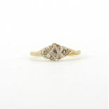 An Art Deco 18ct yellow gold and platinum diamond set ring, (J).