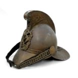 A hammered brass fireman's helmet.