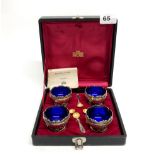 A cased set of reproduction silver plated Monteith Queen Anne style salts.
