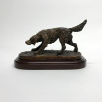 A cast bronze figure of a hunting dog, W. 24cm.