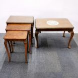 A plate glass topped burr walnut veneered nest of three tables together with a plate glass topped