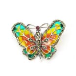 A 925 silver and enamel butterfly brooch set with faceted cut marcasite and a round cut ruby, L. 4.