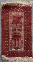 A handwoven Persian wool rug, L. 136cm, W. 82cm.
