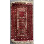 A handwoven Persian wool rug, L. 136cm, W. 82cm.