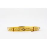 An antique 15ct yellow metal bangle, 6.2 x 4.8cm.