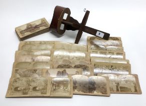 A 19th century hand held stereo photograph viewer, together with a collection of stereo cards.