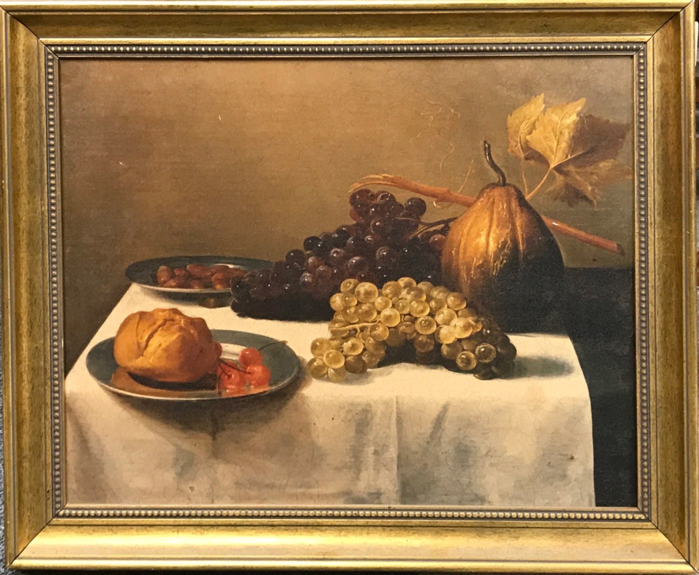 A gilt framed oil finished print depicting a still life, frame size 60 x 48cm.