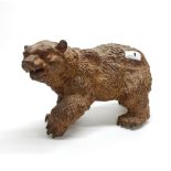 A detailed cast iron figure of a bear, L. 33cm, H. 19cm.