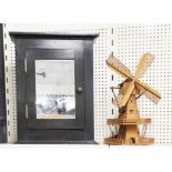 A small pine medicine cabinet, and a handmade wooden windmill, cabinet H. 44cm.