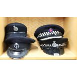 Four Essex police caps.
