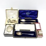 A group of boxed hallmarked silver presentation items.