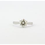 A hallmarked 9ct white gold solitaire ring set with a large brilliant cut diamond, approx. 0.