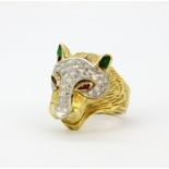 A heavy gent's 18ct yellow gold (stamped 18K) Cartier style ring set with diamonds, emeralds and