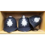 Three old Essex police constabulary helmets.