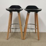 A pair of modern light wood and metal breakfast bar stools, H. 80cm.