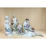 A group of Nao and other similar porcelain figurines, tallest H. 25cm.