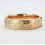 A hallmarked 9ct gold bangle, dia. 6.5 x 5.5cm.