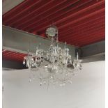 A twelve branch metal and crystal chandelier light fitting.